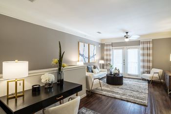 Well-lit room with a black table